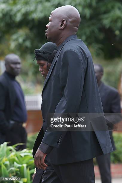 Joseph Tito Manyang and his wife Akon Guode at the funeral of their 3 children Bol, Anger and Madit who were tragically killed when Akon Goude veered...