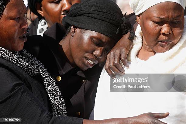 Akon Guode at the funeral of her 3 children Bol, Anger and Madit who were tragically killed when she veered off the road at Wyndham Lakes on April 8...