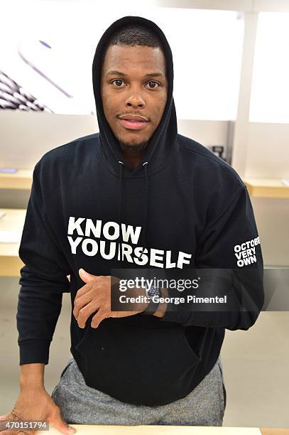 Toronto Raptor player Kyle Lowry tries on Apple Watch at the Apple Store Eaton Centre Toronto on April 17, 2015 in Toronto, Canada.