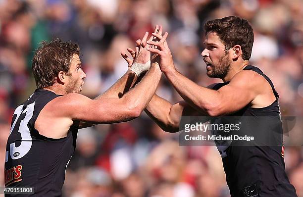 Lachie Henderson of the Blues celebrates a goal with Levi Casboult of the Blues during the round three AFL match between the Carlton Blues and the...