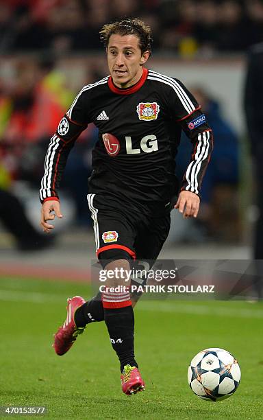 Leverkusen's midfielder Andres Guardado vies for the ball during the first-leg round of 16 UEFA Champions League football match Bayer 04 Leverkusen...