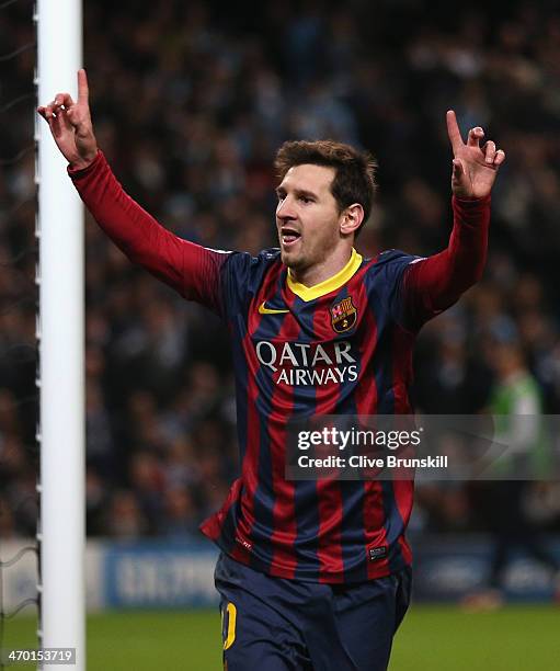 Lionel Messi of Barcelona celebrates scoring the opening goal from a penalty kick during the UEFA Champions League Round of 16 first leg match...