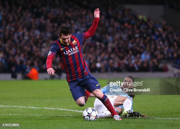 Martin Demichelis of Manchester City fouls Lionel Messi of Barcelona to concede a penalty and is subsequently sent off during the UEFA Champions...