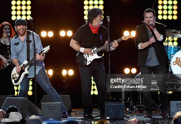 Guitarist James Young of the Eli Young Band, singer/guitarist Randy Owen of Alabama and frontman Mike Eli of the Eli Young Band perform onstage...