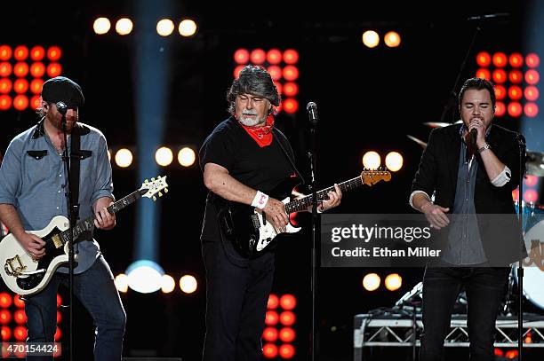 Guitarist James Young of the Eli Young Band, singer/guitarist Randy Owen of Alabama and frontman Mike Elis of the Eli Young Band perform onstage...