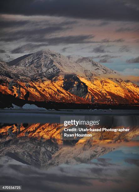 utah lake sunset reflected on melting ice - utah lake stock pictures, royalty-free photos & images