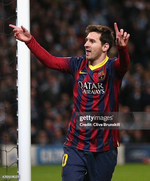 Lionel Messi of Barcelona celebrates scoring the opening goal from a penalty kick during the UEFA Champions League Round of 16 first leg match...