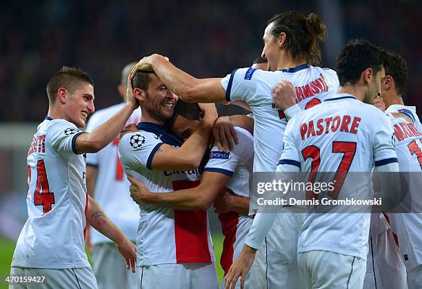 Yohan Cabaye of PSG celebrates with team mates after scoring their fourth goal during the UEFA Champions League Round of 16 first leg match between...