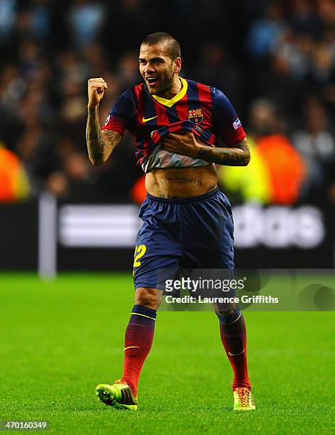 Daniel Alves of Barcelona celebrates scoring his team's second goal during the UEFA Champions League Round of 16 first leg match between Manchester...
