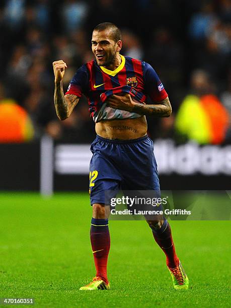 Daniel Alves of Barcelona celebrates scoring his team's second goal during the UEFA Champions League Round of 16 first leg match between Manchester...