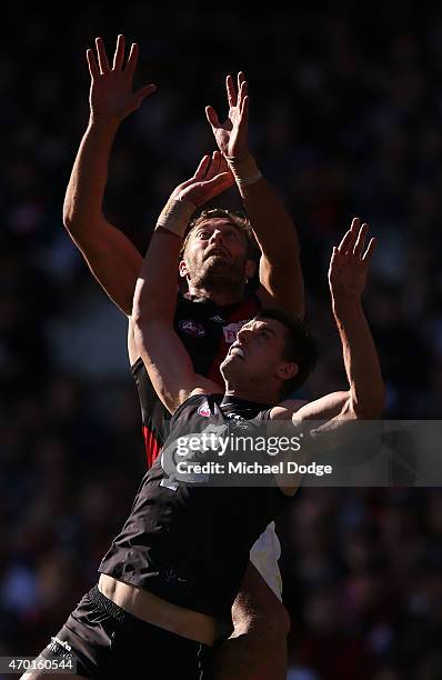 Tom Bellchambers of the Bombers marks the ball over Cameron Wood of the Blues during the round three AFL match between the Carlton Blues and the...