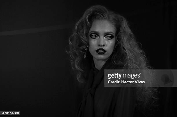 Model gets ready at the backstage during the Page Show as part of Mercedes-Benz Fashion Week Mexico Fall/Winter 2015 at Campo Marte on April 17, 2015...