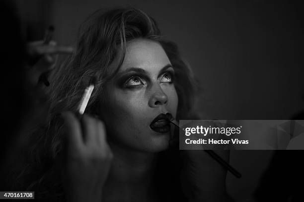 Model gets ready at the backstage during the Page Show as part of Mercedes-Benz Fashion Week Mexico Fall/Winter 2015 at Campo Marte on April 17, 2015...