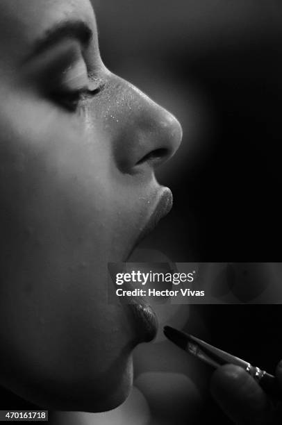 Model gets ready at the backstage during the Page Show as part of Mercedes-Benz Fashion Week Mexico Fall/Winter 2015 at Campo Marte on April 17, 2015...