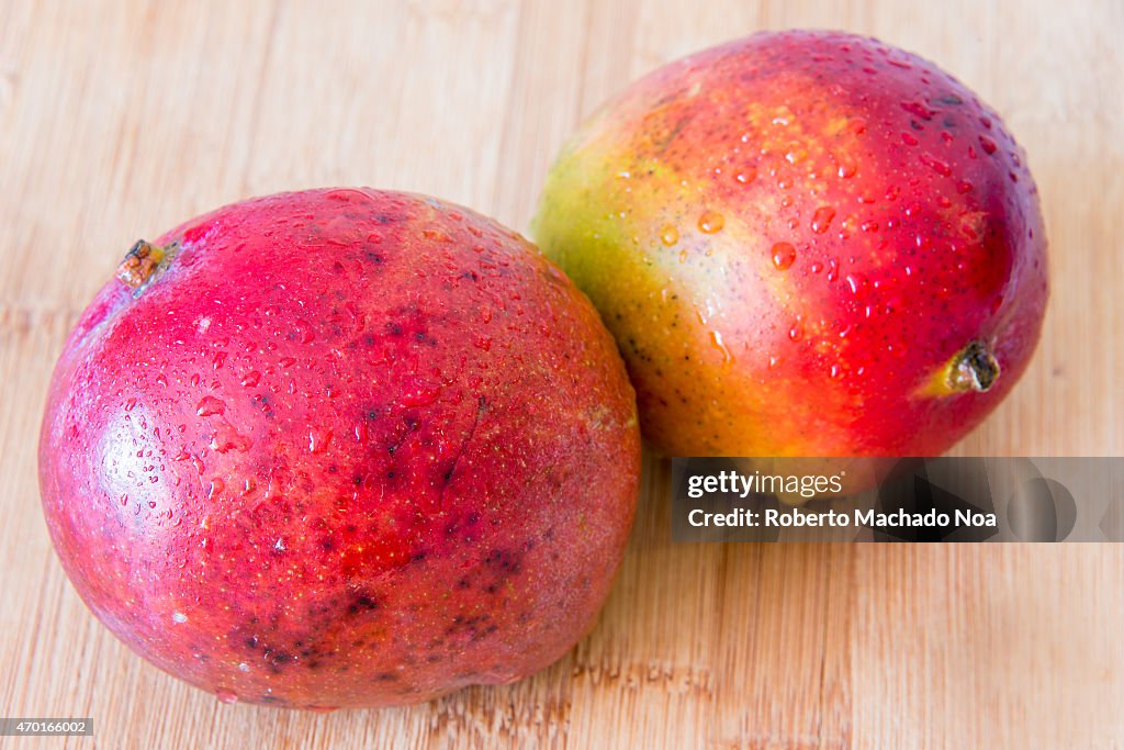 Realistic approach to food: beautiful imperfect mangoes with...