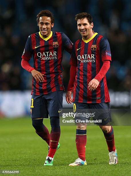 Neymar and Lionel Messi of Barcelona walk off in good spirits following their team's victory at the end of the UEFA Champions League Round of 16...