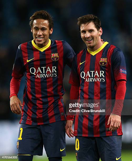 Neymar and Lionel Messi of Barcelona walk off in good spirits following their team's victory at the end of the UEFA Champions League Round of 16...