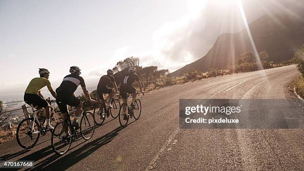 on the country road - racing cyclist stockfoto's en -beelden