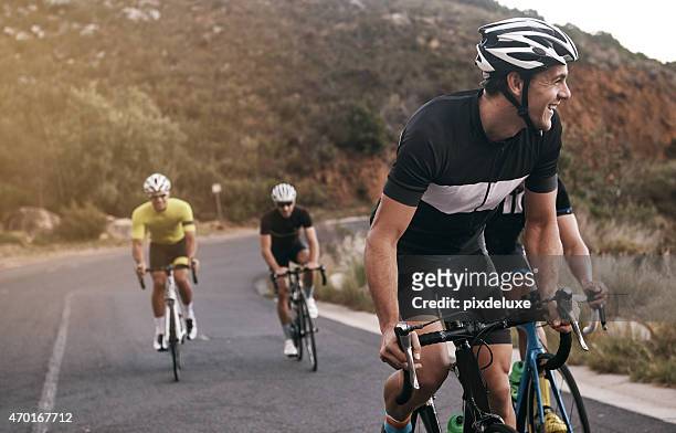 he's enjoying the ride - cycling stock pictures, royalty-free photos & images
