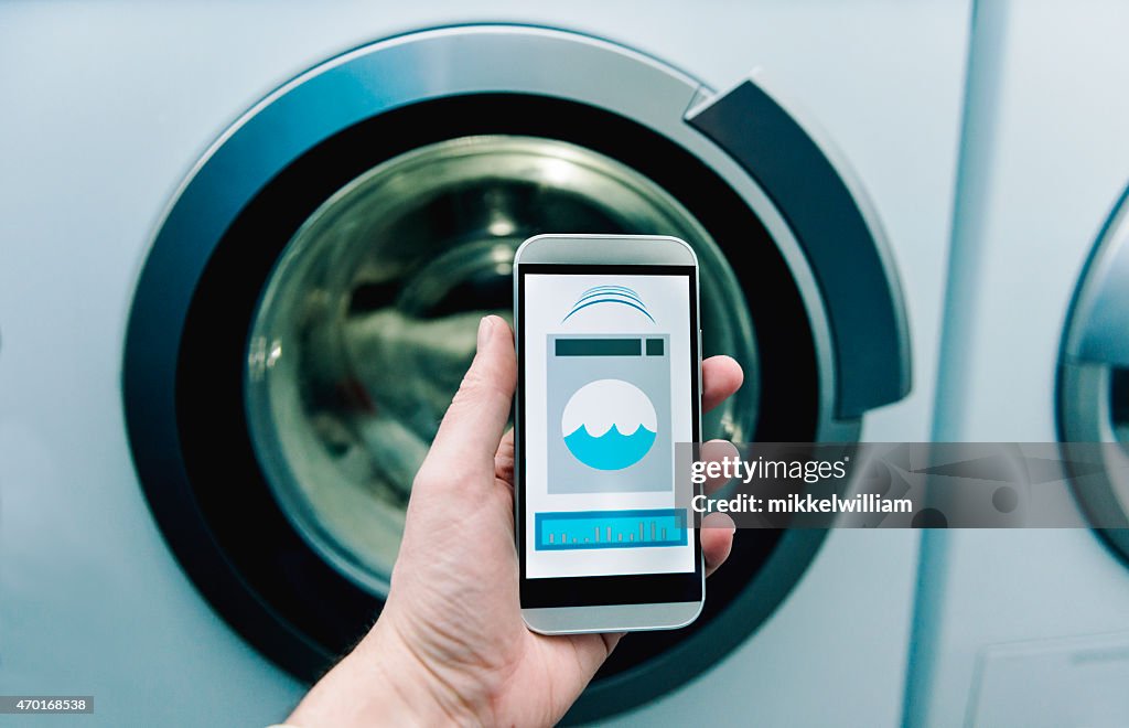 App on phone controls washing machine at home