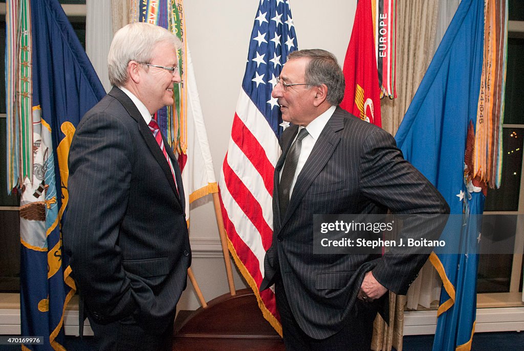 Australian Foreign Minister Kevin Rudd (left) meets with...