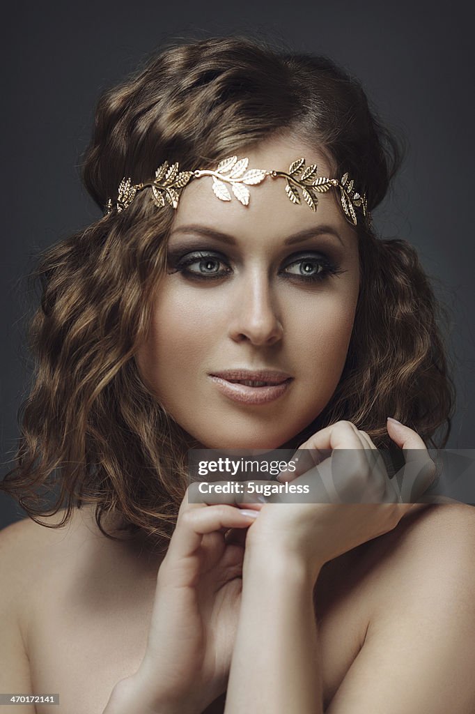 Beautiful woman with golden headband