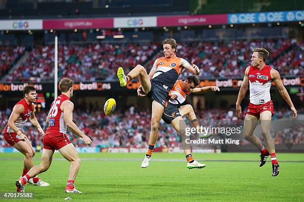 Aidan Corr and Josh Kelly of the Giants competes for the ball during the round three AFL match between the Sydney Swans and the Greater Western...