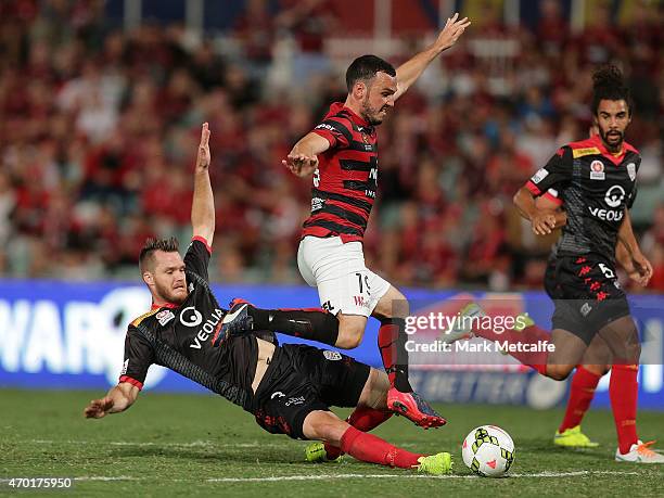 Mark Bridge of the Wanderers is fouled in the area by Nigel Boogard of United during the round 26 A-League match between the Western Sydney Wanderers...