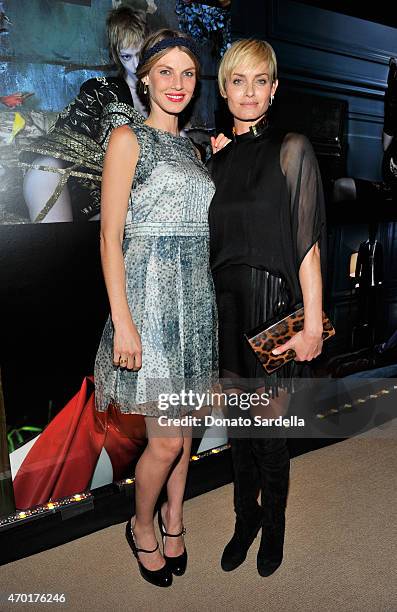 Model Angela Lindvall and model/actress Amber Valletta attend "W Stories" presented by Leon Max and hosted by Stefano Tonchi, Leon Max and Amber...