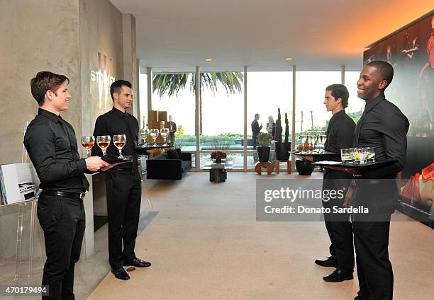 Waiters serve drinks at "W Stories" presented by Leon Max and hosted by Stefano Tonchi, Leon Max and Amber Valletta at a private residence on April...