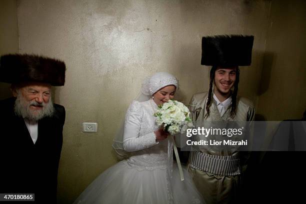 Ultra-Orthodox Jewish bride Rebecca Hanna and her groom Aharon Cruise pause for a photo after their wedding ceremony in the Mea Shearim neighborhood...