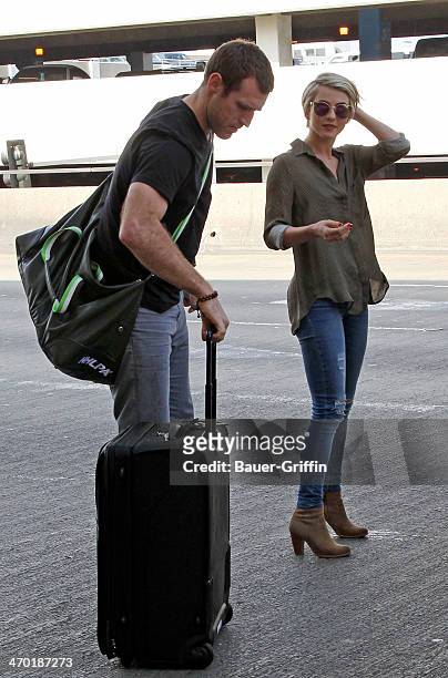 Brooks Laich and Julianne Hough seen at Los Angeles International Airport on February 18, 2014 in Los Angeles, California.