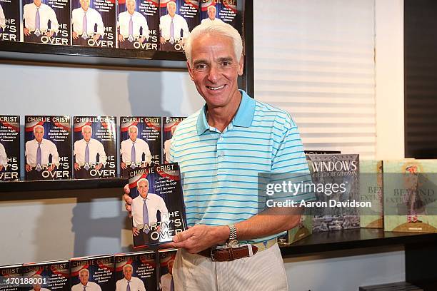 Charlie Crist greets fans and signs copies of his book "The Partys Over: How The Extreme Right Hijacked The GOP And I Became A Democrat" at Books and...