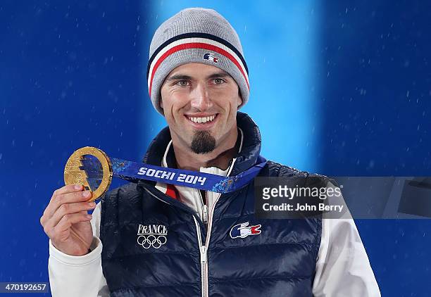 Gold medalist Pierre Vaultier of France celebrates during the medal ceremony for the Men's Snowboard Cross on day 11 of the Sochi 2014 Winter...