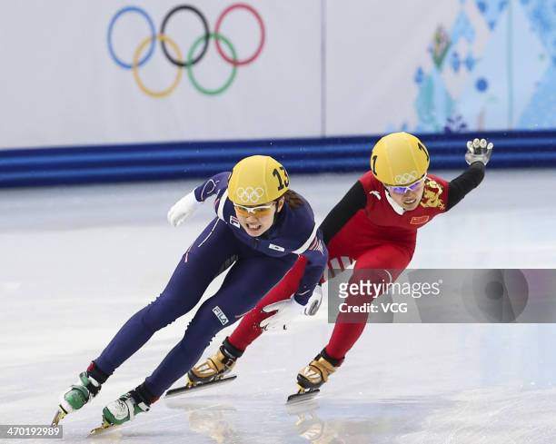 South Korea's Kim Alang and China's Li Jianrou compete in the Short Track Ladies' 3000m Relay Final at Iceberg Skating Palace on day 11 of the 2014...