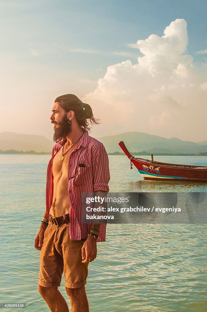 Guy looking into the distance at sea