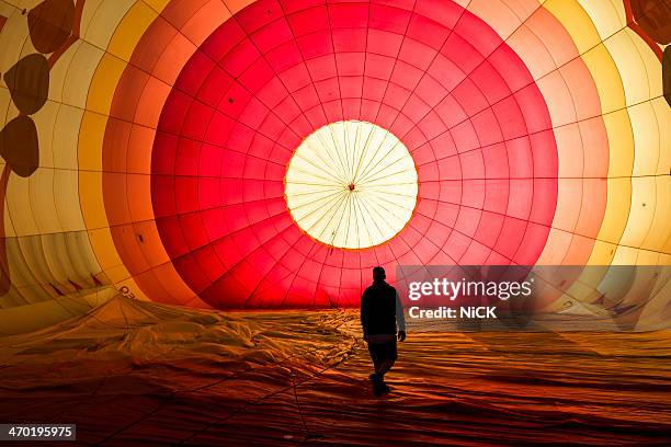 a man walk in the balloon in sunrise - hot air balloon stock pictures, royalty-free photos & images