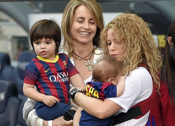 Barcelona's defender Gerard Pique's mother stands beside Pique's wife Shakira and sons Milan and Sasha before the Spanish league football match FC...