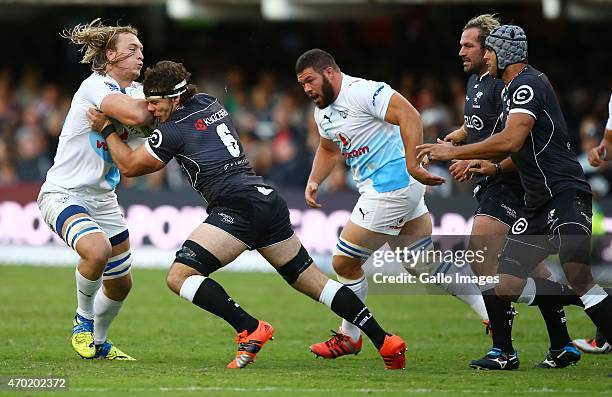 Marcell Coetzee of the Cell C Sharks tackles Jacques du Plessis of the Vodacom Blue Bulls during the Super Rugby match between Cell C Sharks and...