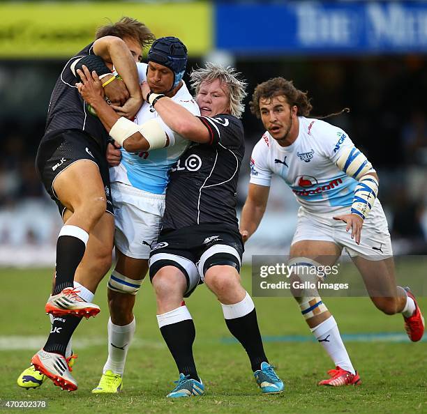 Pierre Spies of the Vodacom Blue Bulls is tackled by Renaldo Bothma of the Cell C Sharks during the Super Rugby match between Cell C Sharks and...