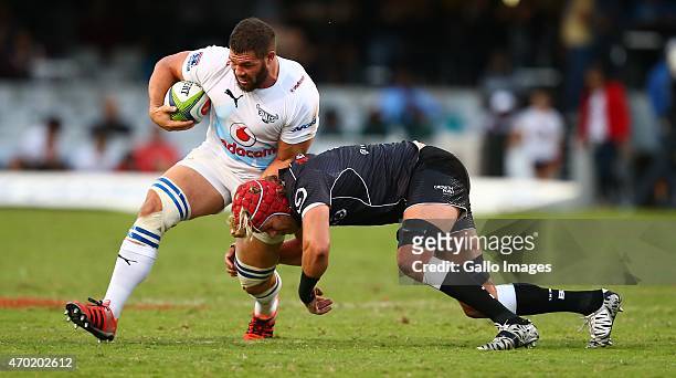 Marcel van der Merwe of the Vodacom Blue Bulls is tackled by Mouritz Botha of the Cell C Sharks during the Super Rugby match between Cell C Sharks...