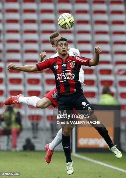 Nice's forward Mohamed Benrahma vies with Paris Saint-Germain's French defender Lucas Digne during the French L1 football match between Nice and...