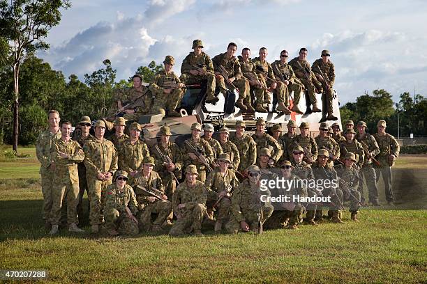 In this handout photo provided by the Australian Defence Force, Prince Harry poses with the participants of Exercise Thunder Observer, a Joint Fire...