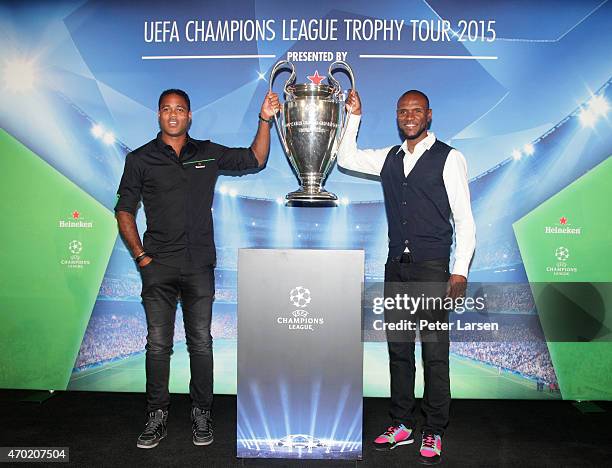 Patrick Kluivert and Eric Abidal hold the trophy at the UEFA Champions League Trophy Tour presented by Heineken - Dallas Stop at Clive Warren Park...