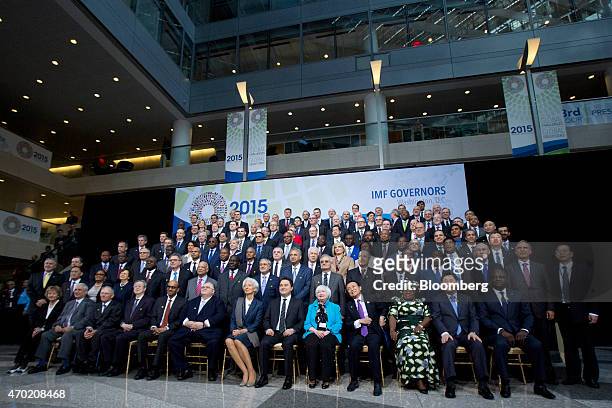 International Monetary Fund governors and delegates have their group photo taken during the International Monetary Fund and World Bank Group Spring...