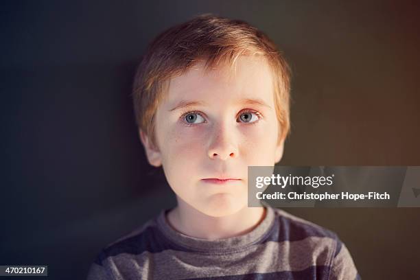 concerned young boy - boy with brown hair and blue eyes stock pictures, royalty-free photos & images
