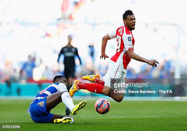 Nathaniel Chalobah of Reading challenges Francis Coquelin of Arsenal during the FA Cup Semi-Final match between Arsenal and Reading at Wembley...