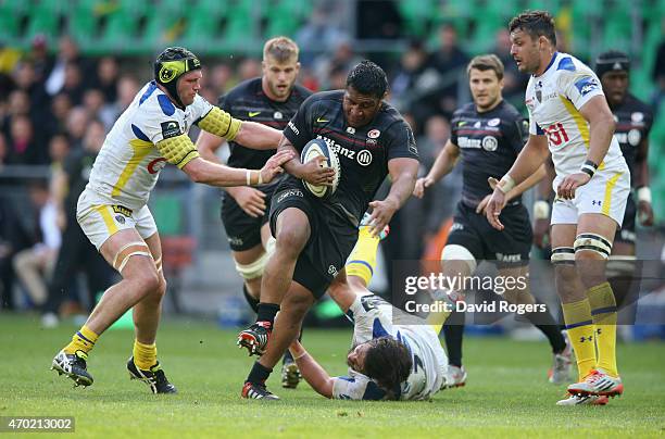 Mako Vunipola of Saracens breaks past Julien Bonnaire during the European Rugby Champions Cup semi final match between ASM Clermont Auvergne and...