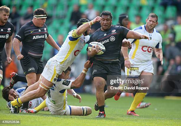 Mako Vunipola of Saracens breaks past Julien Bonnaire during the European Rugby Champions Cup semi final match between ASM Clermont Auvergne and...