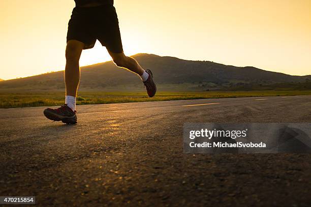 mountain road runner - marathon feet stock pictures, royalty-free photos & images